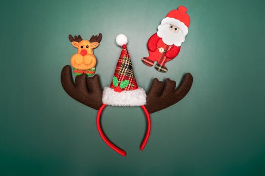 Christmas background concept. Top view of Christmas gift box and decoration on green background