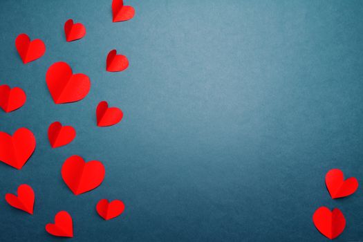 Valentine card with red heart on blue background, abstract, flat lay, top view