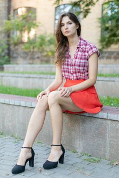 Girl in a red plaid shirt