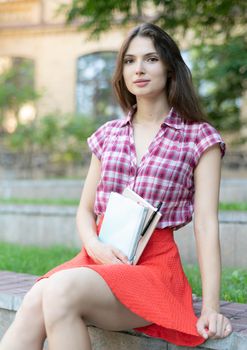 Young girl student on a bench. Kyiv. Ukraine