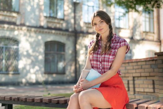 Young girl student on a bench. Kyiv. Ukraine