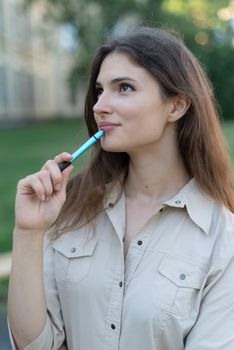 Young girl student with pen.