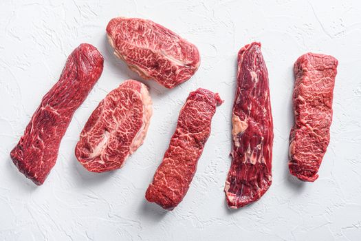 Set of denver, top blade, tri tip steak, machete, flank, bavette London broil marble beef on white background top view .