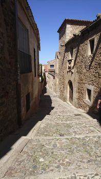 Caceres, Spain, April 2017: narrow streets and alleys of the historical old town of Caceres, Extremadura, Spain.