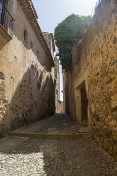 Caceres, Spain, April 2017: narrow streets and alleys of the historical old town of Caceres, Extremadura, Spain.