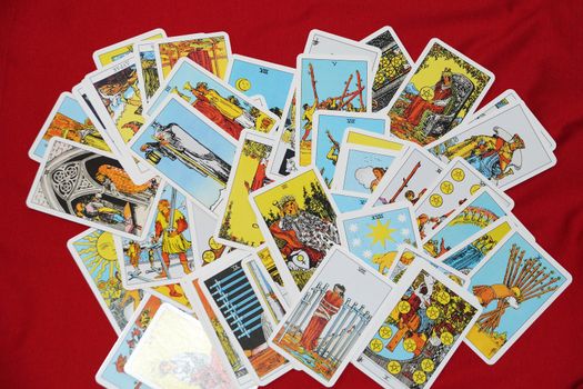 Varna, Bulgaria - September,12 , 2020: esoteric background of scattered tarot cards close up