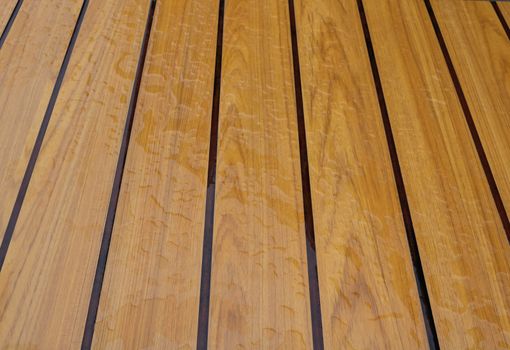 Drops of water on wooden bench after the rain, natural weather background.