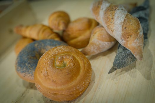 Baked goods are beautifully laid out on a linen towel