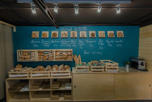 Fresh baked goods are beautifully arranged on display in wooden crates.