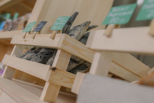 Fresh baked goods are beautifully arranged on display in wooden crates.