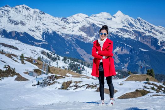 Young Woman Tourists see beautiful viewpoitn near Kleine Scheidegg station In daylight atI Switzerland