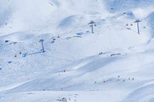 Panoramic view of ski chair lift in high mountains in Switzerland