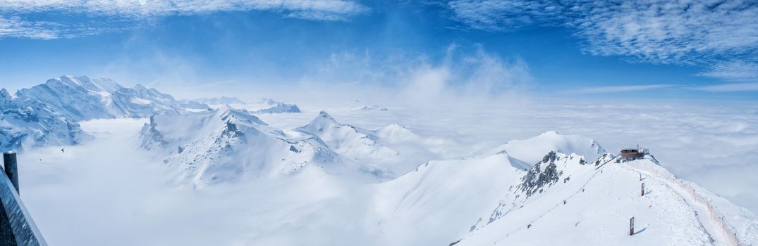 Stunning Panoramic view Snow moutain of the Swiss Skyline from Schilthorn Piz Gloria, Switzerland