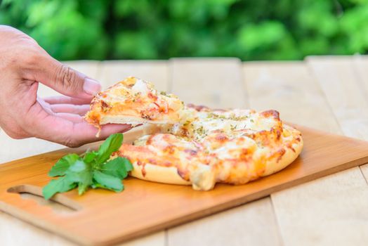 pizza Hawaiian Home made on wood plate