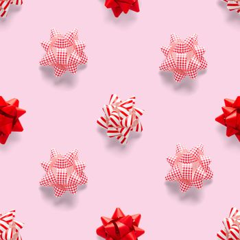 Seamless regular creative Christmas pattern with New Year decorations on pink background. xmas Modern Seamless pattern made from christmas decorations. Photo quality pattern for fabric, prints, wallpapers, banners or creative design works.