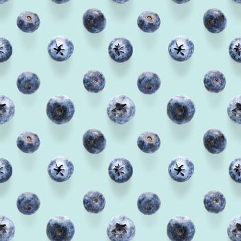 Trendy seamless pattern of blueberries. Blueberry pattern isolated on blue background. Blueberry flat lay, can be used for textile, prints, packing designs orother moden andcreative works