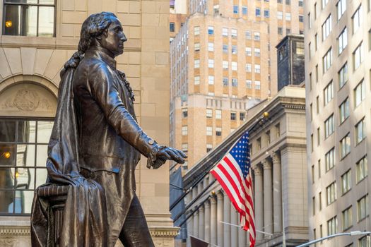 Wall Street  in Manhattan Finance district and Washington statue in the foreground