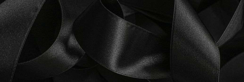 Black silk ribbon as background, abstract and luxury brand designs