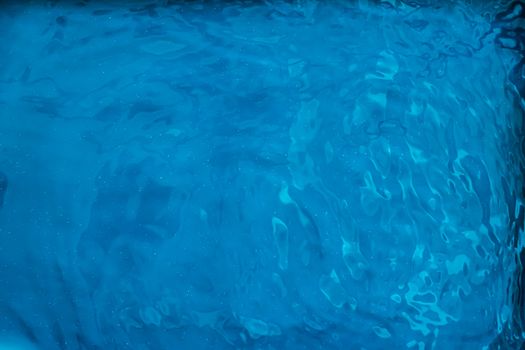 Blue water texture as abstract background, swimming pool and waves designs