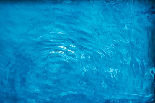 Blue water texture as abstract background, swimming pool and waves designs