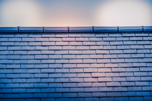 Slate roof against cloudy sky in York UK