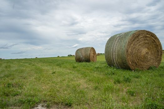 Beautiful landscape with straw bales in end of summer