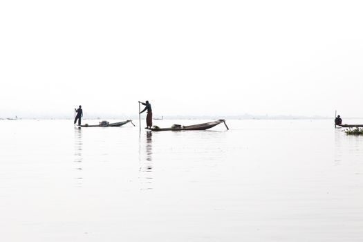 Inle Lake, Myanmar 12/16/2015 traditional Intha fisherman rowing with one leg . High quality photo