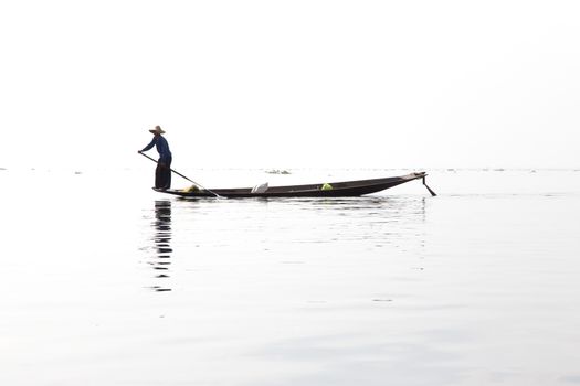 Inle Lake, Myanmar 12/16/2015 traditional Intha fisherman rowing with one leg . High quality photo