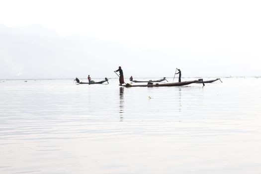 Inle Lake, Myanmar 12/16/2015 traditional Intha fisherman rowing with one leg . High quality photo