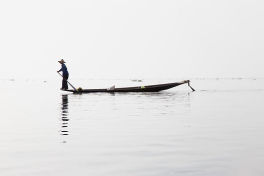 Inle Lake, Myanmar 12/16/2015 traditional Intha fisherman rowing with one leg . High quality photo