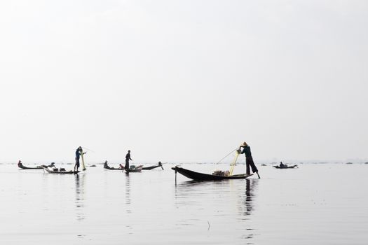 Inle Lake, Myanmar 12/16/2015 traditional Intha fisherman rowing with one leg . High quality photo