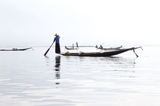 Inle Lake, Myanmar 12/16/2015 traditional Intha fisherman rowing with one leg . High quality photo