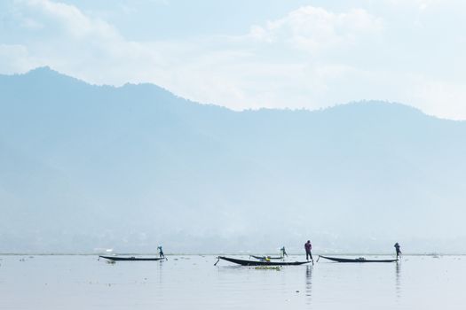 Inle Lake, Myanmar 12/16/2015 traditional Intha fisherman rowing with one leg . High quality photo