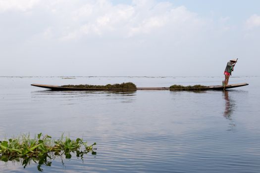 Inle Lake, Myanmar 12/16/2015 traditional Intha fisherman rowing with one leg . High quality photo