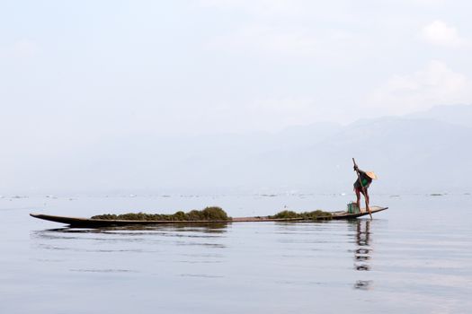 Inle Lake, Myanmar 12/16/2015 traditional Intha fisherman rowing with one leg . High quality photo