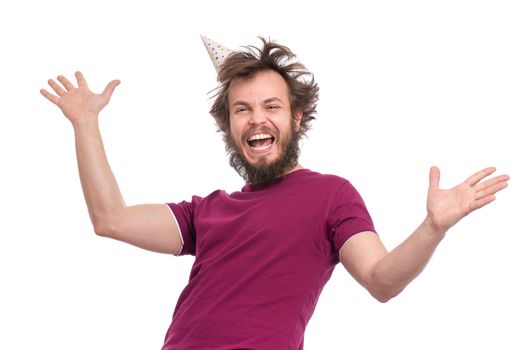 Crazy bearded Man with funny Haircut in birthday cap, isolated on white background. Happy guy screaming and keeping mouth open. Holidays, Emotions and Signs concept.