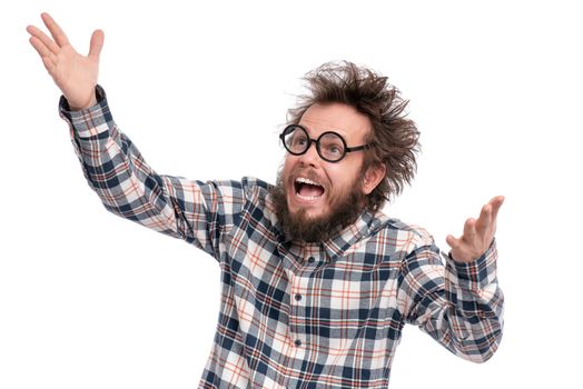 Crazy bearded Man with funny Haircut in Eyeglasses, isolated on white background. Happy guy in plaid shirt is greeting - screaming and keeping mouth open. Emotions and signs concept.