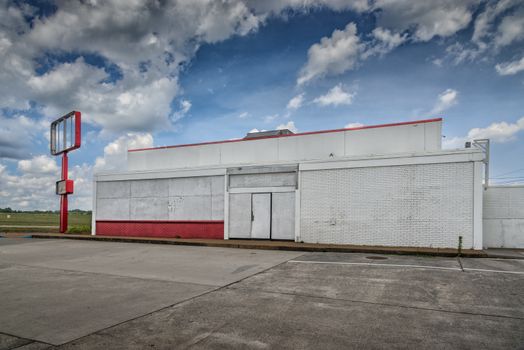 Horizontal shot of a bankrupt fast food restaurant after the 2020 Pandemic.