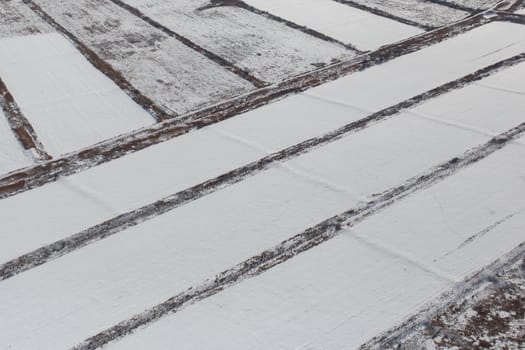 View from above. Agricultural fields in winter.