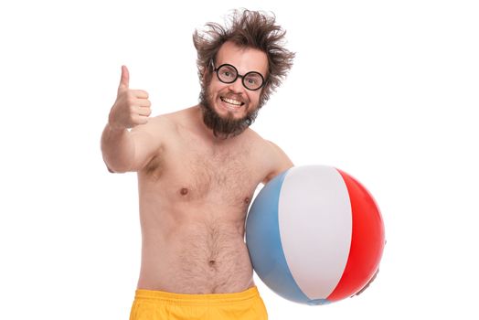 Crazy bearded Man with funny Haircut in eye Glasses making Thumbs up Gesture. Happy and silly tourist, isolated on white background. Cheerful naked man holding Sea Ball.