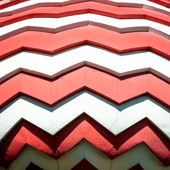 Onion dome of Saint Basil Cathedral on Red Square in Russia. Close up view of curved red and white ornament.  Famous historic sight in Moscow. Russian Orthodox church of sixteenth century.