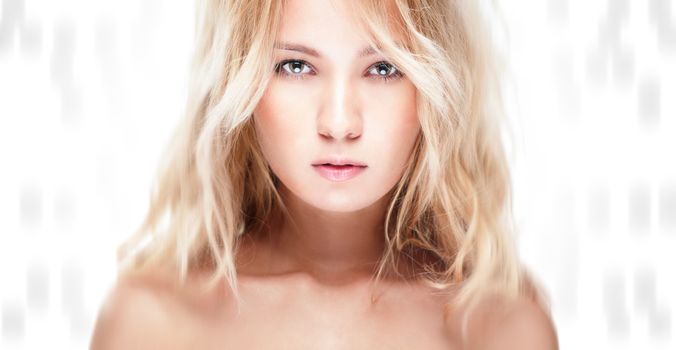 Sensual portrait of young beautiful blonde woman on white background. Sexy topless girl with curly hair looking passionate and tempting. Youth, pure natural beauty and passion.