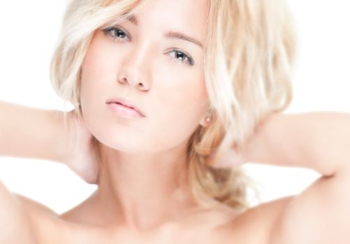 Sensual portrait of young beautiful blonde woman on white background. Sexy topless girl with curly hair looking passionate and tempting. Youth, pure natural beauty and passion.