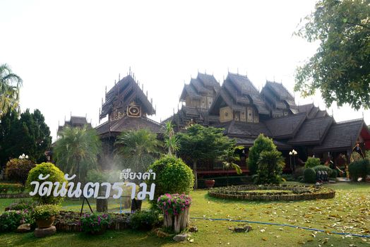 Phayao, Thailand  – 21 December, 2019 : Wat Nantaram is a Tai Yai (Shan-style) community temple in central Chiang Kham and exhibits the classic Tai Yai roof architecture, somewhat extraordinary