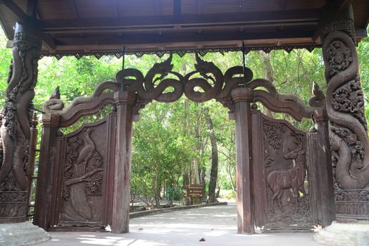 Phayao, Thailand – 21 December, 2019 : Carved wooden door in Wat Analyo Thipayaram, Phayao province, Thailand