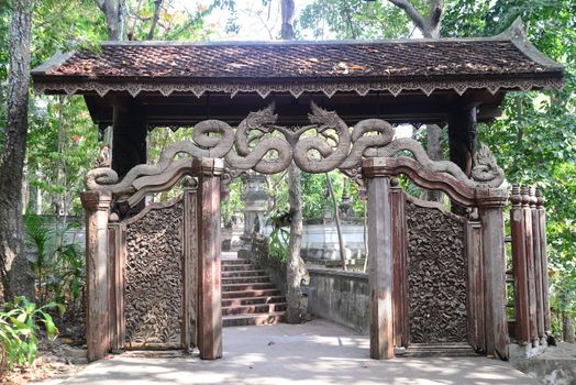 Phayao, Thailand – 21 December, 2019 : Carved wooden door in Wat Analyo Thipayaram, Phayao province, Thailand