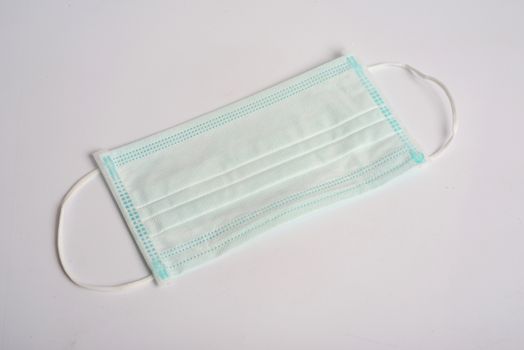 Disposable Hygienic Mask to cover the mouth and nose. Procedure mask from bacteria. Protection concept.