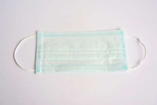 Disposable Hygienic Mask to cover the mouth and nose. Procedure mask from bacteria. Protection concept.