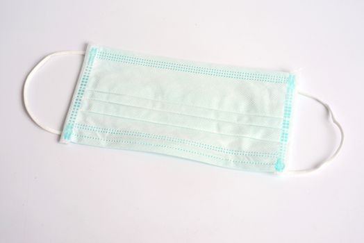 Disposable Hygienic Mask to cover the mouth and nose. Procedure mask from bacteria. Protection concept.