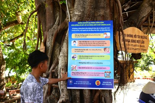 NHA TRANG, VIETNAM – 28 FEBRUARY 2020 : The label  guidance sign for the protection against Covid 19 virus is  Vietnamese In tourist spots